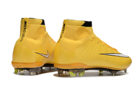 Nike Mercurial Superfly IV Elite FG laser orange soccer cleats in lifestyle setting